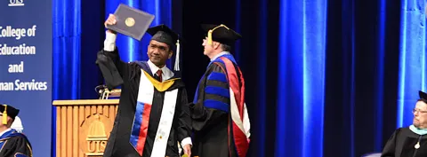 Students celebrate graduation during the 48th annual UIS Commencement ceremonies
